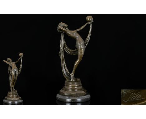 A Reproduction Art Deco Bronze Figure Raised on circular black marble plinth in the form of an arching rythmic gymnast with b