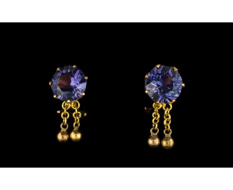 Ladies 18ct Gold And Amethyst Set Clip Earrings Comprising circular faceted amethyst stones, mounted in 18ct gold, marked to 