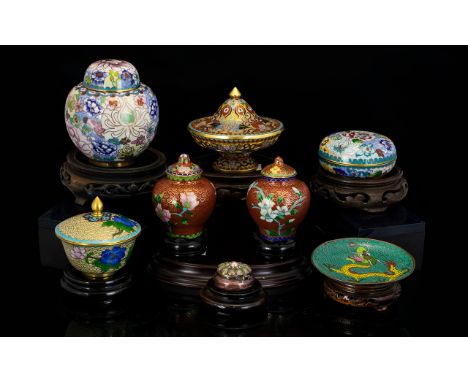 A Collection Of Twentieth Century Oriental Cloisonne Items Eight in total, each with carved and footed wooden plinth. To incl