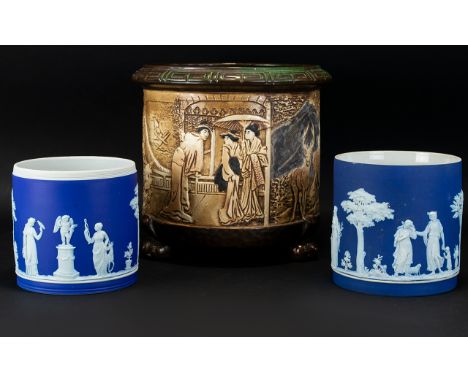 Bretby Moulded Jardiniere with Oriental Decoration to entire surface (small chip to rim). Raised on claw feet tripod base. To