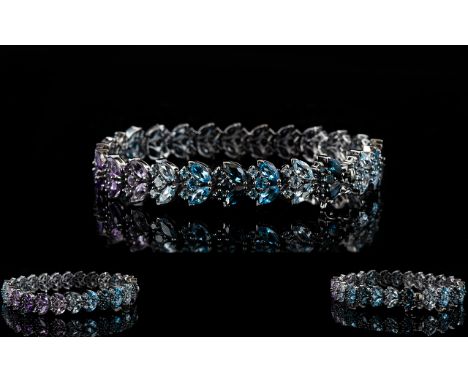 Shades of Blue Topaz and Purple Amethyst Bracelet, a 14.5ct line of clusters in the formation of Sky blue topaz, Swiss blue t