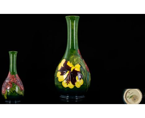 William Moorcroft Signed Tube lined Tall Vase In The ' Hibiscus ' Pattern. c.1940. Label to Base Reads - Potters to the Late 