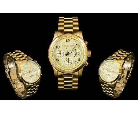 Michael Kors MK 5055 Unisex Runway Gold Tone Chronograph Watch. Features Push Button, Deployment Clasp, Champagne Dial, Quart