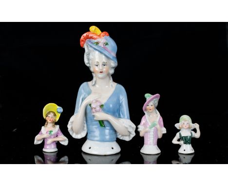 Ceramic Half Boudoir Doll Along With Three Miniature Examples Early 20th century half doll in glazed ceramic with four holes 