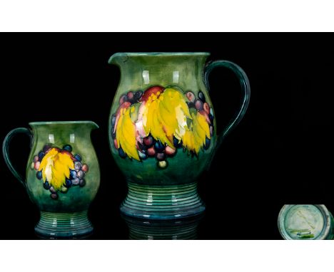 William Moorcroft 1930's Signed Jug ' Leaf and Berries ' Design on Green / Blue Ground with Interesting Ribbed Design to Bott