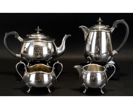 A Silver Plated Tea And Coffee Service Comprising teapot, coffeepot, sugar bowl and milk jug, each with claw feet and typical