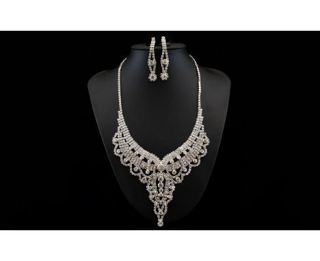 White Crystal V Shaped Collar Necklace and Long Drop Earrings, multiple rows of crystals interspaced with larger crystals and