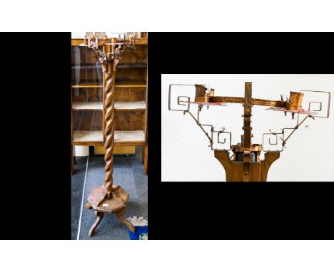 A floor Standing Four-branch Candelabra. Raised on octagonal base with quatrafoil legs and barley twist pillaster.  Height 55
