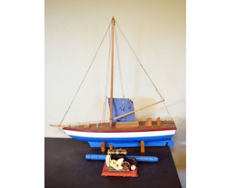 Mid 20th Century pond yacht, 88cm long, together with a small stationary steam engine   Condition: 