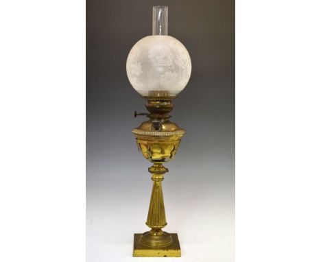 Victorian brass oil lamp standing on a flared reeded pillar and square base, foliate etched glass globular shade   Condition: