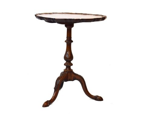 Old reproduction Georgian style mahogany wine table, the circular snap top having a pie-crust edge, standing on a turned and 