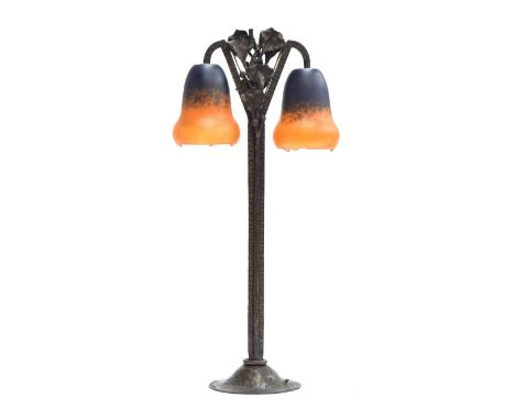An Art Nouveau twin fitting table lamp, the patinated wrought iron stand by Barthelemie, signed, with domed foot, knurled str