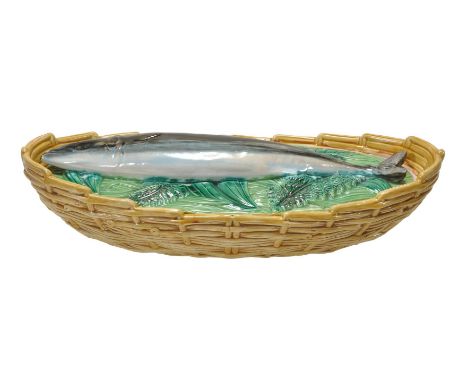 A George Jones majolica mackerel oval fish tureen and cover, circa 1871, with ochre ozier-moulded tureen base and a naturalis