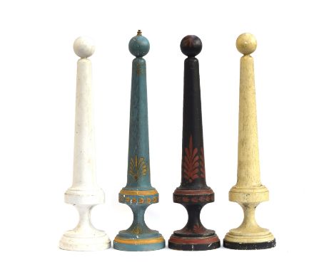 A set of four early 20th century polychrome and turned wood lamp bases of tapering form, each 72cm high 