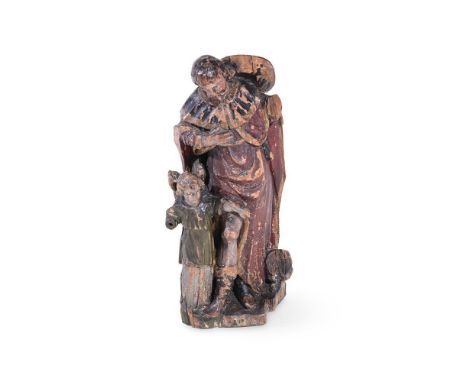 An early 19th century carved and polychrome figural group, possibly Swiss Tyrol, depicting a man with hat and flowing cloak, 