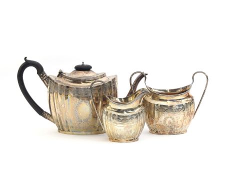 A George V three piece teaset by George Nathan &amp; Ridley Hayes, Chester 1908 and 1911, with bright cut decoration, the tea