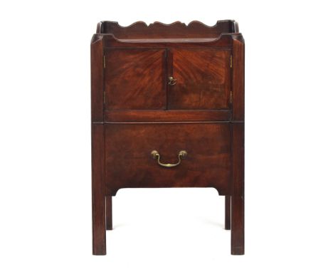 A George III mahogany tray top night commode, galleried with handles, over a pair of doors above pull out commode drawer with