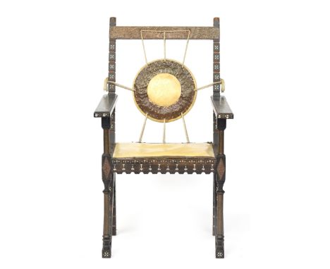 Carlo Bugatti (1856-1940), an ebonised elbow chair, inlaid alla certosina work, the straight arms inlaid with white metal Jap