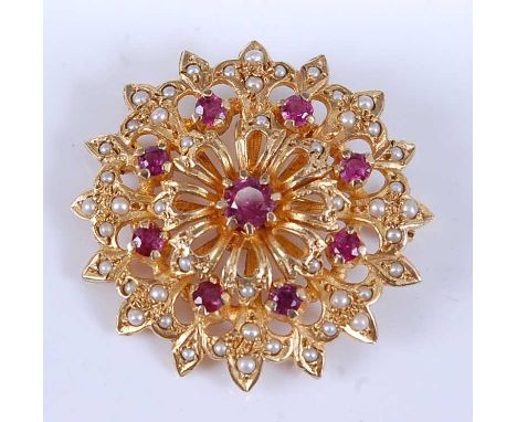 A yellow metal, ruby and pearl circular cluster brooch, comprising nine round faceted rubies and forty-eight 1.2 to 1.6mm see