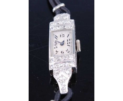 An Art Deco white metal cased lady's tank cocktail watch, having an unsigned Arabic dial within two rows of pavé set small ro