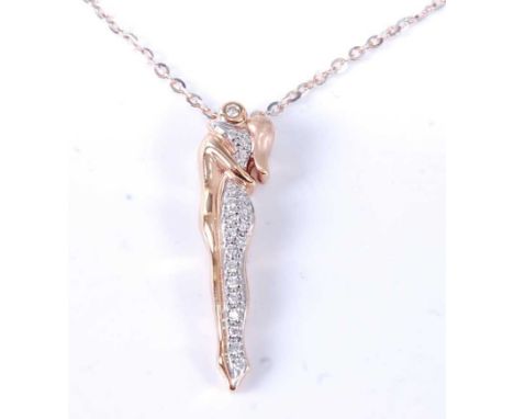 A rose and white metal diamond pendant in the form of an embracing couple, the female figure pavé set with 19 round brilliant