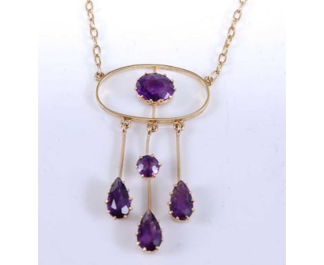A yellow metal amethyst openwork pendant, comprising a centre oval faceted amethyst with three bars suspended below with thre