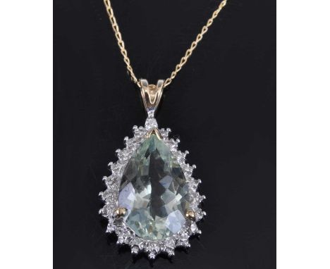 A yellow and white metal, prasoiolite and diamond pear shaped cluster pendant, featuring a pear cut prasiolite within an illu