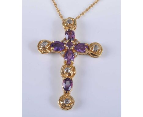 An 18ct yellow gold, amethyst and diamond fancy cross pendant, comprising five pear and one round cut amethyst with nine roun