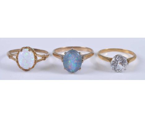 Three rings, being a 9ct yellow gold synthetic opal single stone ring, the opal measuring approx 8.85 x 6.85 x 2.5mm, size P,