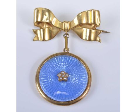 A 9ct yellow gold bow brooch, having a yellow metal blue guilloche enamel pendant suspended below set with six 1.5mm seed pea