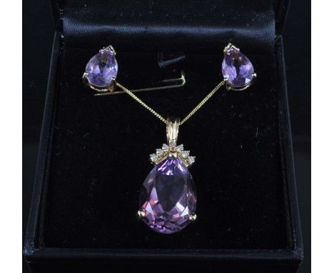 A 14ct yellow gold, amethyst and diamond pendant and earring set, the pendant featuring a pear cut amethyst in a claw setting