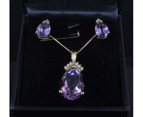 A 14ct yellow gold, amethyst and diamond pendant and earring set, the pendant featuring a pear cut amethyst in a claw setting