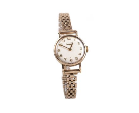 LADY'S LONGINES NINE CARAT GOLD MANUAL WIND WRIST WATCH,the round cream dial with Arabic hour markers, outer seconds track in