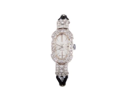 LADY'S INCABLOC PLATINUM AND DIAMOND MANUAL WIND COCKTAIL WATCH,the oval silvered dial with baton hour markers, 15mm diamond 