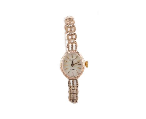 LADY'S EVERITE NINE CARAT GOLD QUARTZ WATCH,the oval cream dial with baton hour markers, 14mm case, on a nine carat gold gate