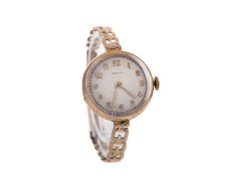 LADY'S ROLCO NINE CARAT GOLD MANUAL WIND WRIST WATCH,the round cream dial with Arabic hour markers, outer railroad seconds tr