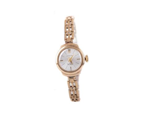 LADY'S LEGION NINE CARAT GOLD MANUAL WIND WRIST WATCH,the round silvered dial with baton hour markers, 16mm case, on a nine c