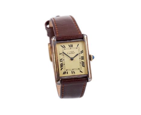 LADY'S MUST DE CARTIER SILVER GILT MANUAL WIND WRIST WATCH,the rectangular cream dial with Roman hour markers, railroad inner