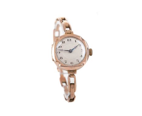 LADY'S NINE CARAT GOLD MANUAL WIND WRIST WATCH,the round silvered dial with Arabic hour markers, outer seconds track in black