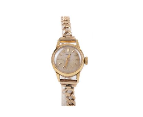 LADY'S TURLER GOLD MANUAL WIND WRIST WATCH,the round cream dial with baton hour markers, 17mm case, in eighteen carat gold, o