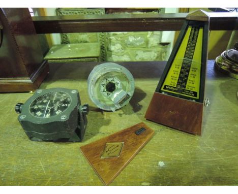 A metronome, a small marine compass and a hand held marine compass by Henry Browne & Sons