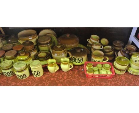 An extensive collection of T G Green brown glazed kitchen wares including storage jars inscribed Tea, Rice, Sugar, etc, a che