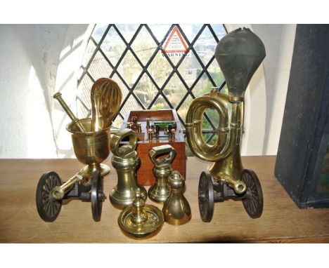 A vintage brass automobile horn together with a brass powder flask with stamped detail to mount Sykes Patent with embossed do