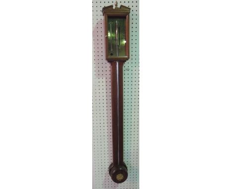 A Georgian style walnut stick barometer with engraved brass dial set beneath an architectural frieze