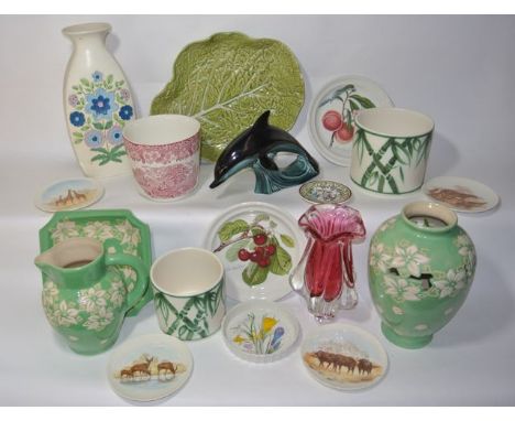 A collection of ceramics including a green ground jug with incised stylised floral decoration, a matching vase with pierced d