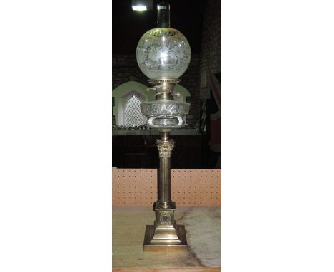 A Victorian Corinthian column oil lamp with square cut base with cut glass reservoir and twin burner