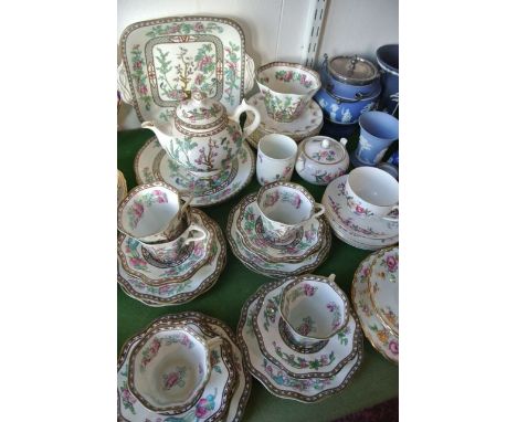 A collection of Wedgwood blue ground Jasperwares comprising two biscuit barrels with plated mounts and covers, a three piece 