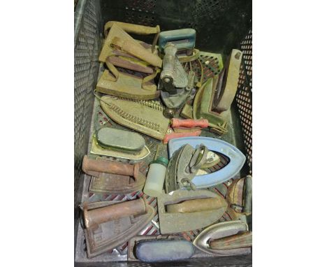 A quantity of antique and vintage domestic irons to include flat irons, one stamped Siddons, an example with embossed hand gu