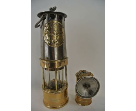 A miners lamp in brass and steel with applied brass plaque reading Hailwood & Ackroyd Makers Hailwoods Improved Morley, Leeds