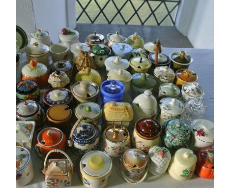 An extensive collection of various jam, marmalade, honey and other preserve pots including example by Wilkinson Limited with 